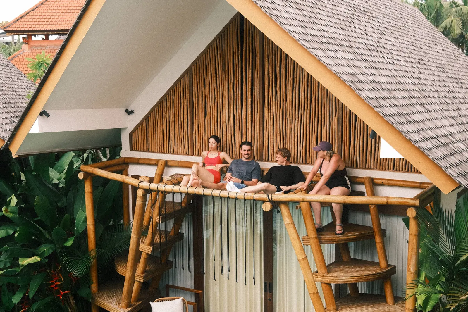 Founders relaxing on a bungalow balcony at the villa