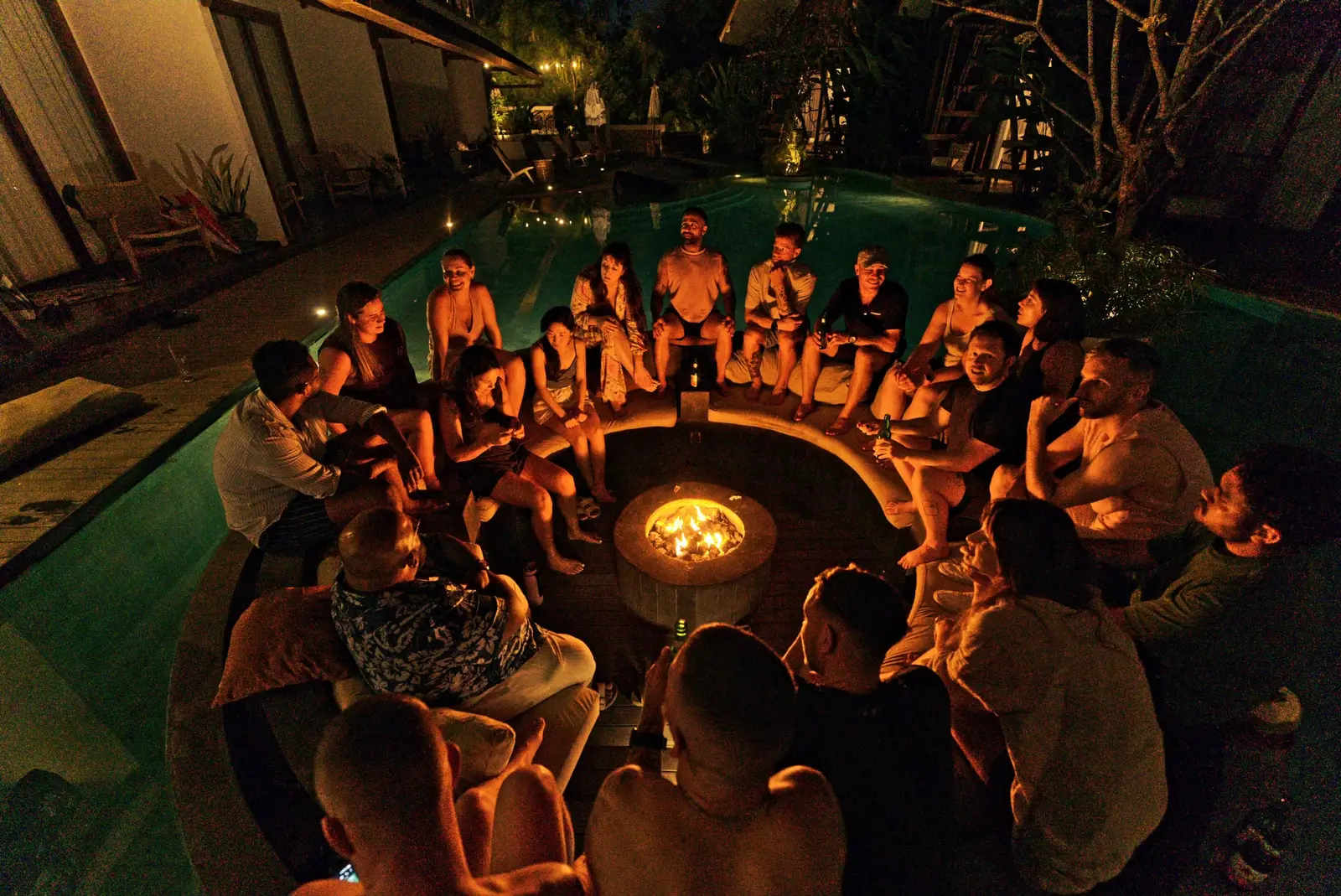 The retreat group around the fire pit at night